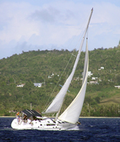 SV Joss sails the West Coast of Guam in the Philippine Sea.